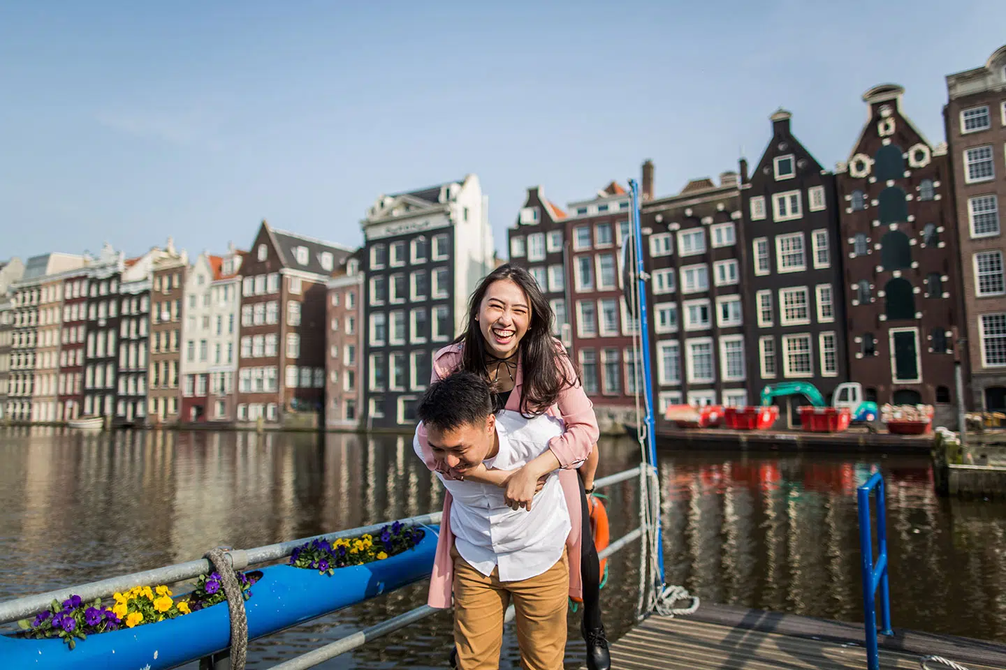 Couple having fun during their photoshoot in Amsterdam