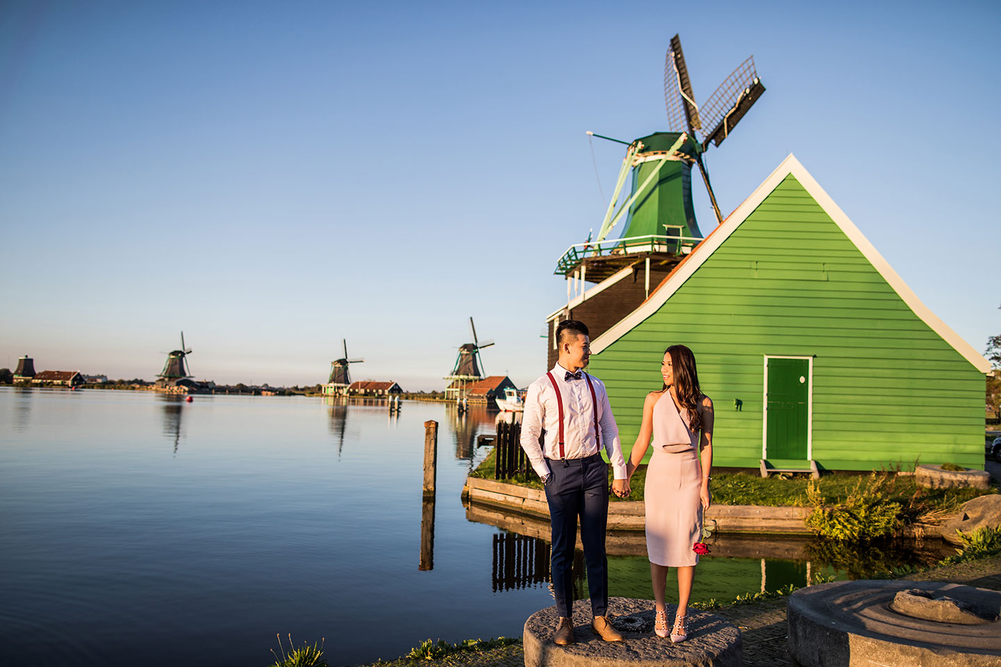 Prewedding shoot at sunset with windmills in the Netherlands