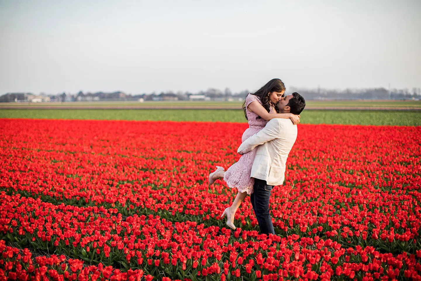 Prewedding shoot in red tulip fields